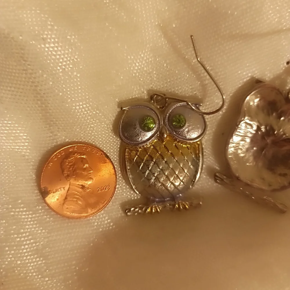 Two toned silver and gold tone green eye owl dangle earrings